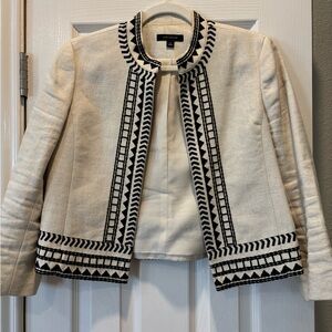 Ann Taylor cream jacket with black embroidery.